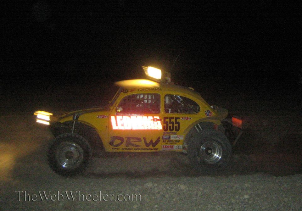Yellow Volkswagen Beetle Baja race car number 555 at night