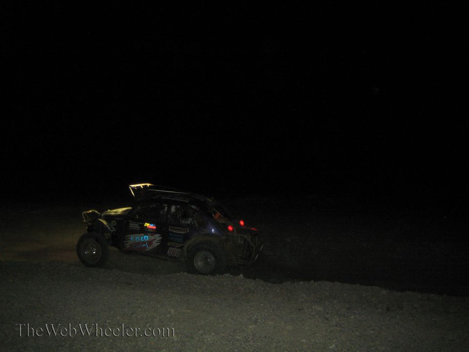 Off-road buggy with light bar racing at night