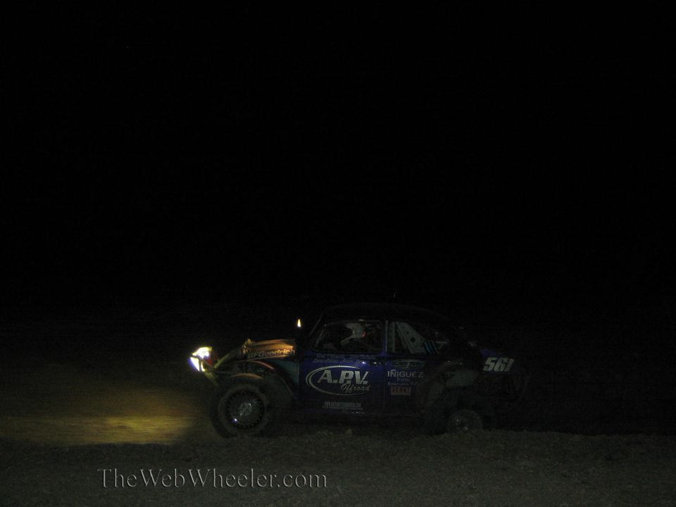 Blue Baja Bug race car number 561 at night