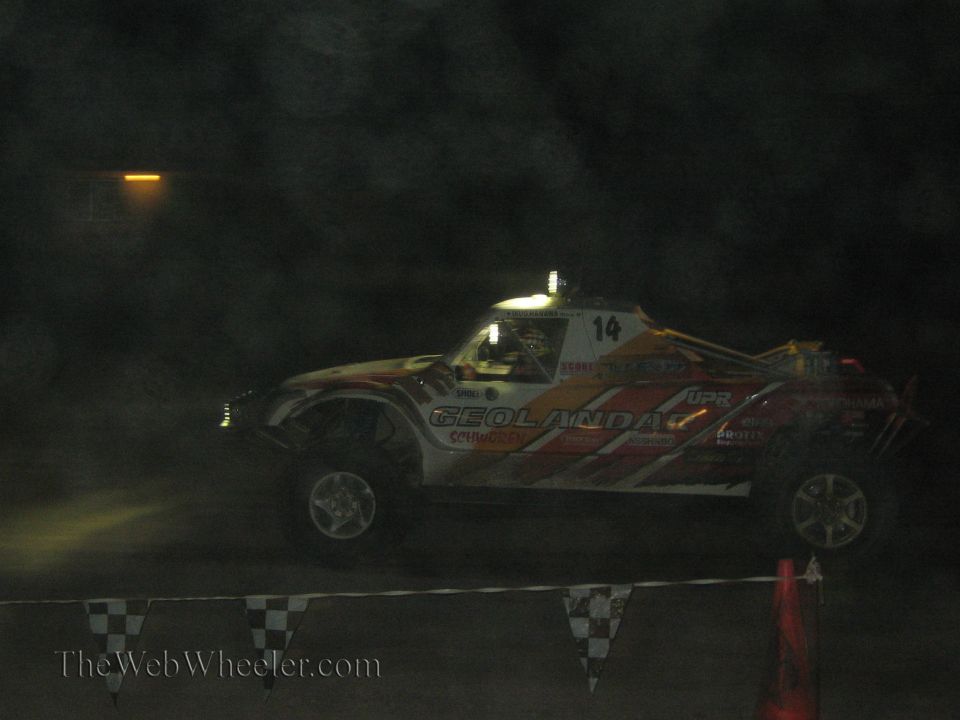 Geolandar-sponsored off-road race truck number 14 at night