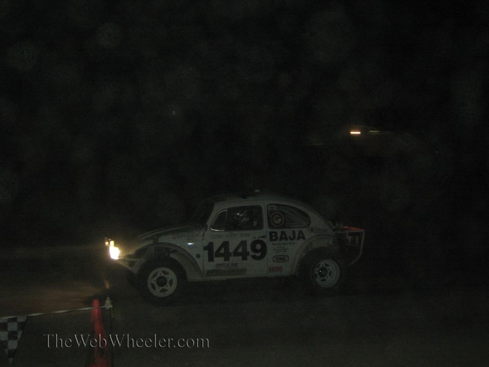 White Baja Beetle race car number 1449 at night