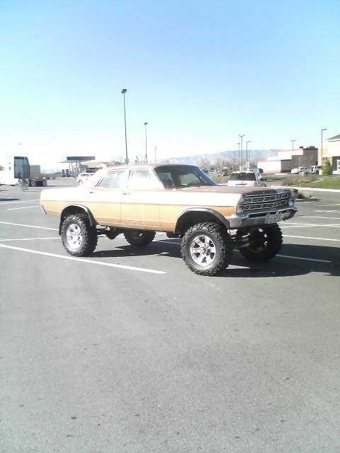 1991 Ford Bronco - This lifted 1968 Ford sedan features a two-tone paint scheme and aggressive off-road tires.