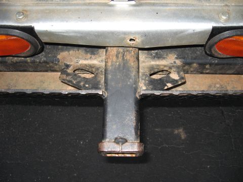 1977 Ford F-150 - Close-up view of the rear bumper and trailer hitch assembly on a 1977 Ford F-150 pickup truck.