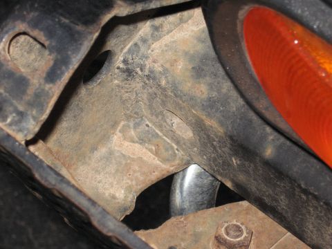 1977 Ford F-150 - Close-up of the rear frame and tail light assembly on a 1977 Ford F-150.