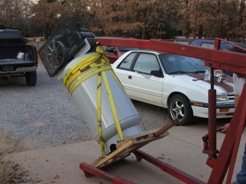 1965 Ford Mustang - An engine hoist is used to lift a large propane tank with an air compressor attached.