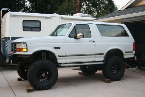 1992 Ford Bronco - White 1992 Ford Bronco modified with a lift kit and oversized tires.