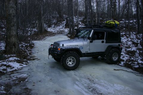 2003 Jeep TJ - Silver 2003 Jeep TJ Rubicon parked on an icy road in a wooded area during winter.