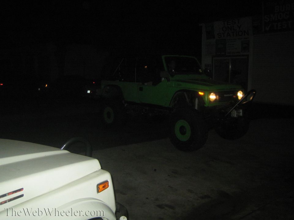 Green 1987 Suzuki Samurai with off-road modifications