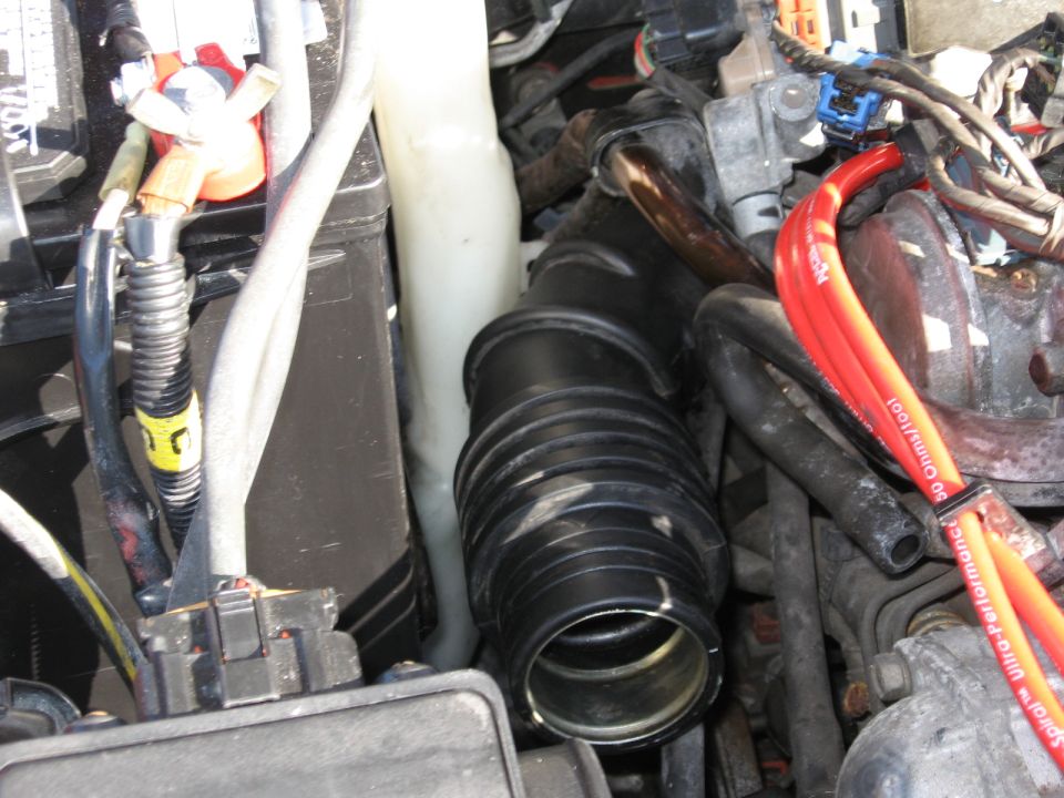 Engine bay intake hose and battery terminals