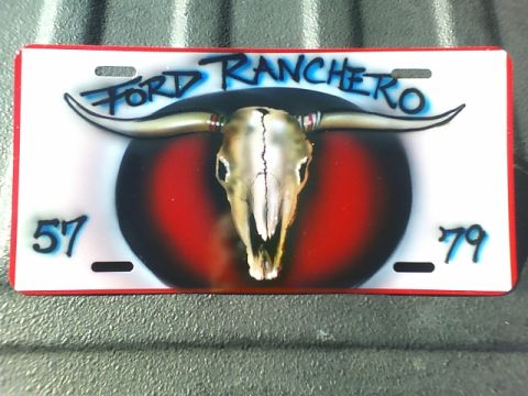 1979 Ford Ranchero - This license plate displays "FORD RANCHERO" and the numbers "57" and "79" alongside a bull skull graphic.