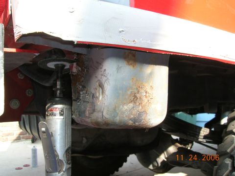 1985 Ford Bronco - Undercarriage repair in progress, showing rust and metalwork on a vehicle.