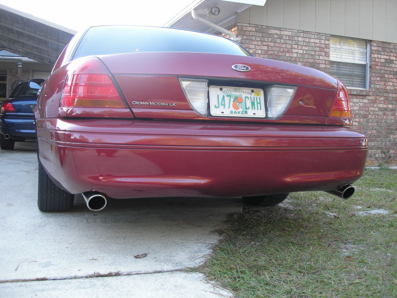 Red 2003 Ford Crown Victoria LX rear with custom dual exhaust