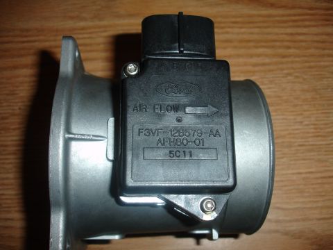 1993 Ford Taurus - Close-up of a Ford mass air flow sensor, part number F3VF-12B579-AA.