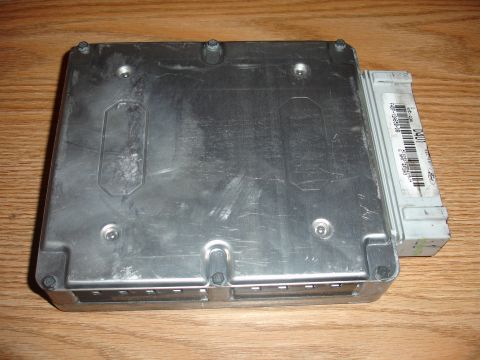 1993 Ford Taurus - An engine control unit is shown, with visible text on its label.