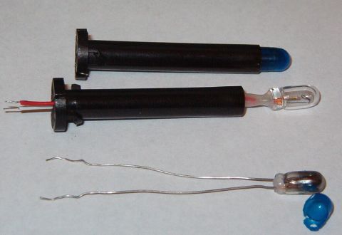 1999 Ford Crown Victoria - Since there's glue & heat-shrink tubing on the base of this bulb, it doesn't fit into the holder correctly, either. But its leads are sligh…
