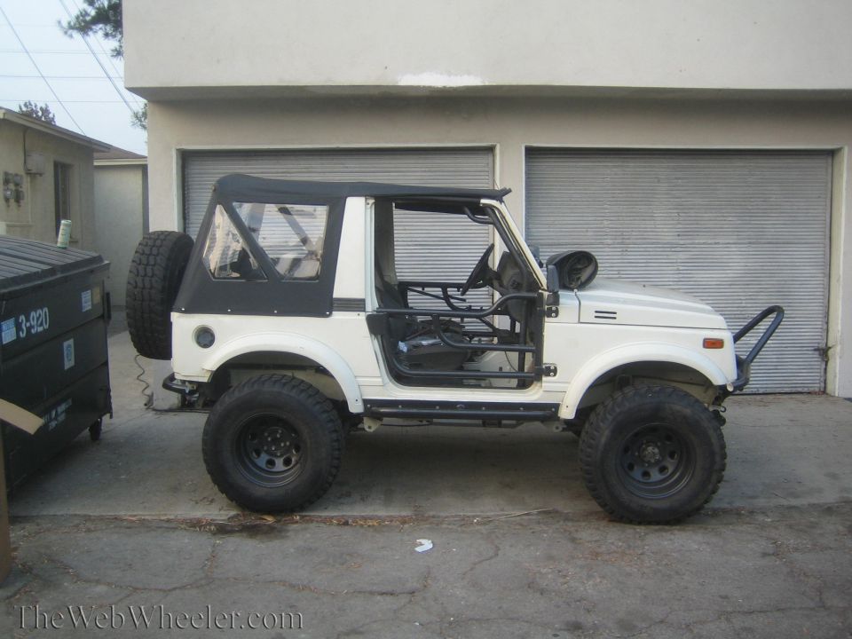 1987 Suzuki Samurai, white, soft top, off-road tires, roll cage, spare tire on rear