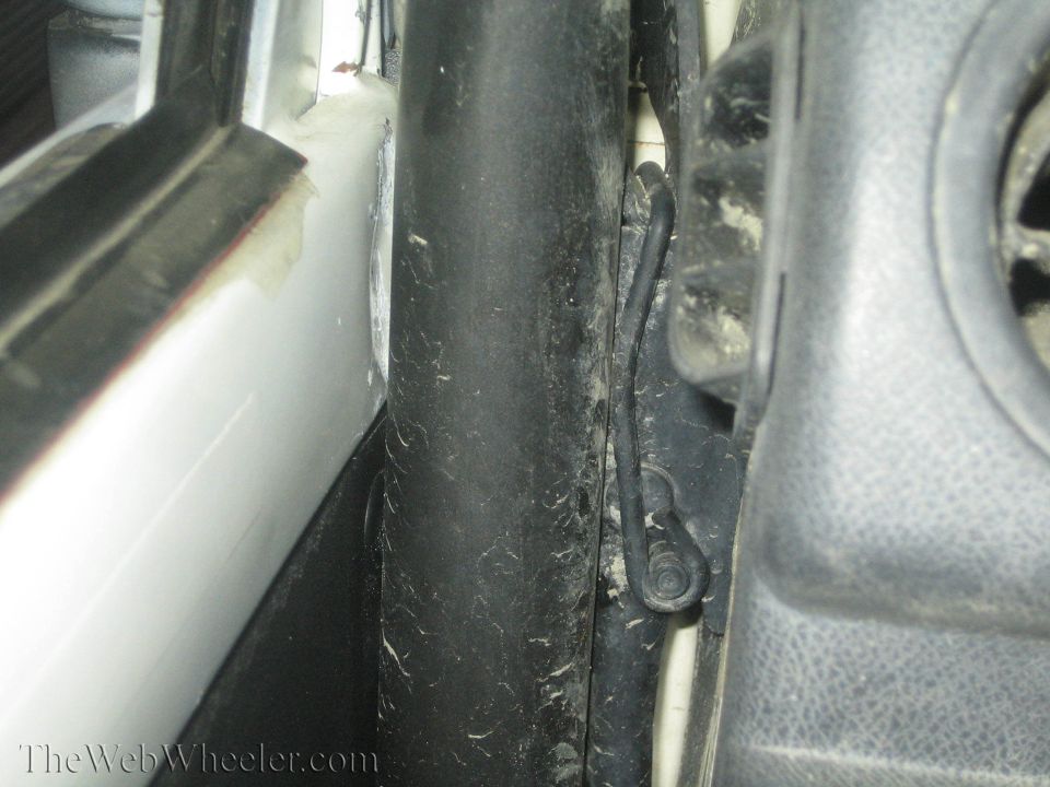 White door frame and black rubber seal of a 1987 Suzuki Samurai interior