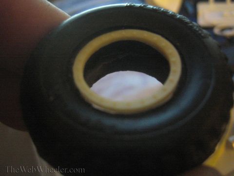 1968 Ford Mustang - Detail of a model car tire and wheel assembly, likely for a scale model kit.