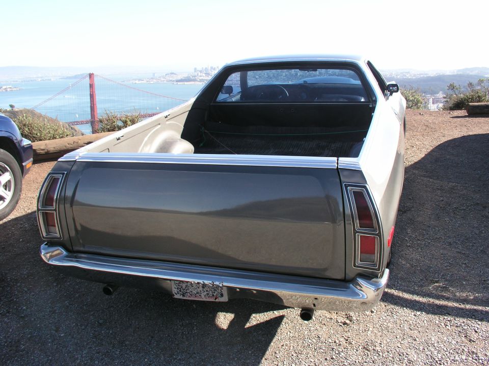 Rear view of a 1972 Ford Ranchero with the Golden Gate Bridge in the background