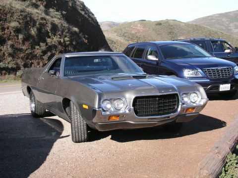 1972 Ford Ranchero - A 1972 Ford Ranchero is parked on a gravel road with hills in the background.