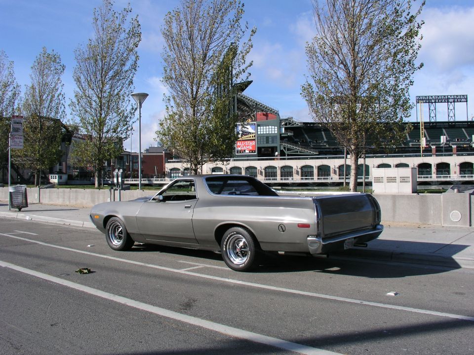Silver 1972 Ford Ranchero parked on street, rear quarter view