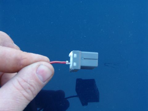 1999 Ford Crown Victoria - While holding the pawl up, roll your fingertips to pull the wire out of the connector, then release the pawl & remove the screwdriver.