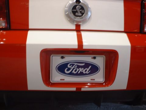 2000 Ford Crown Victoria - This Ford Mustang Shelby GT500 features racing stripes and a Ford oval emblem on the rear.