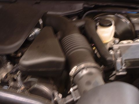 2000 Ford Crown Victoria - Close-up of a vehicle's engine air intake system components.