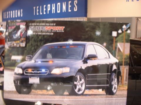 2000 Ford Crown Victoria - This Subaru Legacy is equipped with a light bar and appears to be a police vehicle.