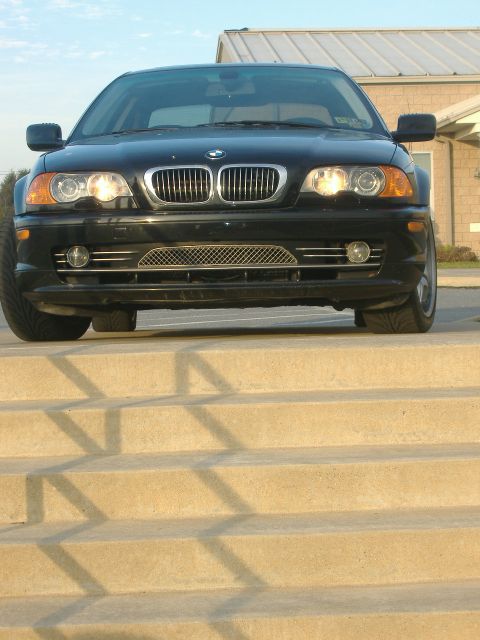 2001 BMW 3 Series - Front view of a black 2001 BMW 3 Series sedan parked on concrete steps.