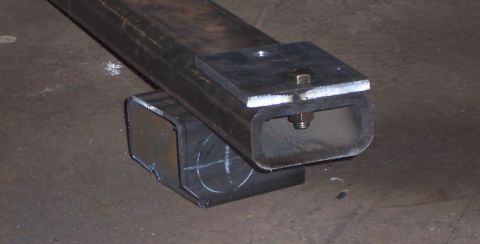1978 Ford Bronco - A close-up view of a metal tubing assembly, likely a custom part for a vehicle modification.