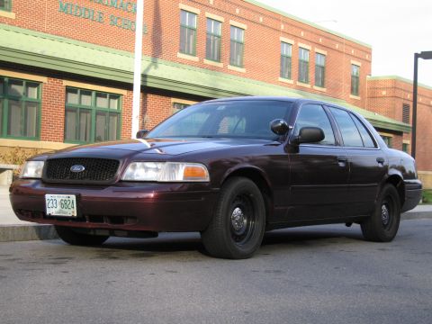 1991 Ford LTD Crown Victoria - This Ford Crown Victoria sedan, likely from the early 2000s, is seen parked in front of a brick building.