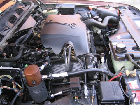 1991 Ford LTD Crown Victoria - Close-up view of a car's engine bay, showing various components and wiring.