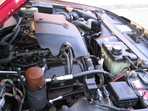 1991 Ford LTD Crown Victoria - Close-up view of a car's engine bay, showing various components and wiring.