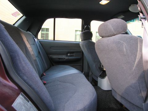 1991 Ford LTD Crown Victoria - Interior view of a 1991 Ford Crown Victoria LTD, focusing on the rear seating area.