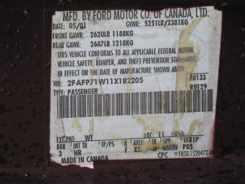 1991 Ford LTD Crown Victoria - Ford door-jamb certification data plate showing VIN, gross vehicle weight ratings, and build information.