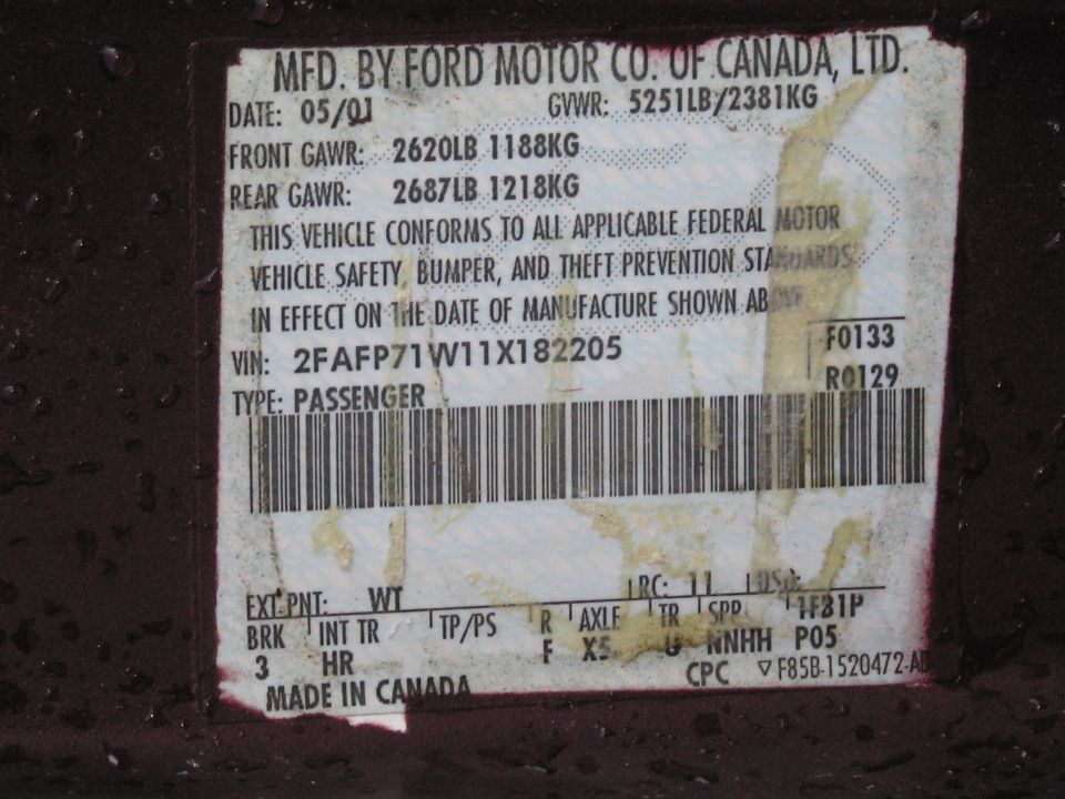 Ford door certification data plate with VIN, GVWR, and manufacture date, made in Canada