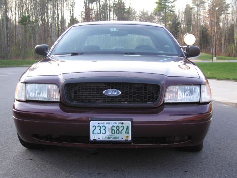 1991 Ford LTD Crown Victoria - This maroon Ford Crown Victoria is seen from the front. The license plate is from New Hampshire.