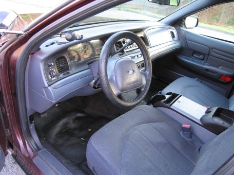 1991 Ford LTD Crown Victoria - The interior of a Ford Crown Victoria, the driver's side dashboard and front seating area.