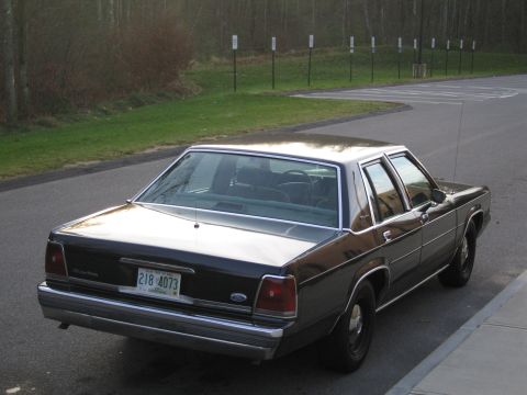 1991 Ford LTD Crown Victoria - Rear view of a 1991 Ford Crown Victoria LTD showing its distinctive taillights and chrome bumper.