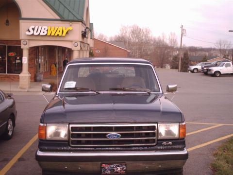 1990 Ford Bronco - Front view of a 1990 Ford Bronco parked in front of a Subway restaurant.
