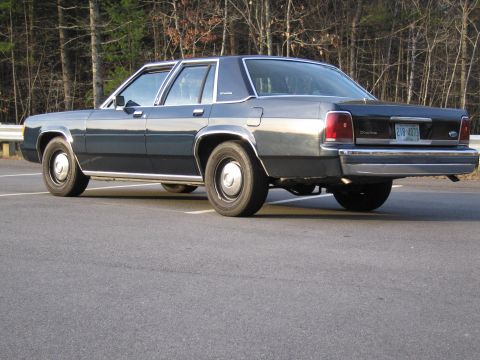 1991 Ford LTD Crown Victoria - This 1991 Ford Crown Victoria has a dark blue exterior and is parked in an outdoor lot.