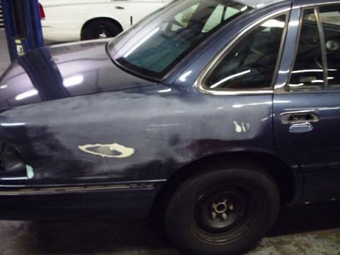 1996 Ford Crown Victoria - Bodywork in progress on a 1996 Ford Crown Victoria, with another vehicle visible behind it.
