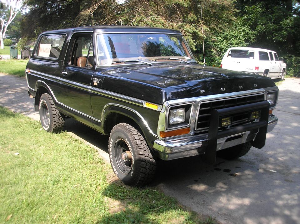 Black 1978 Ford Bronco with chrome grille and bull bar