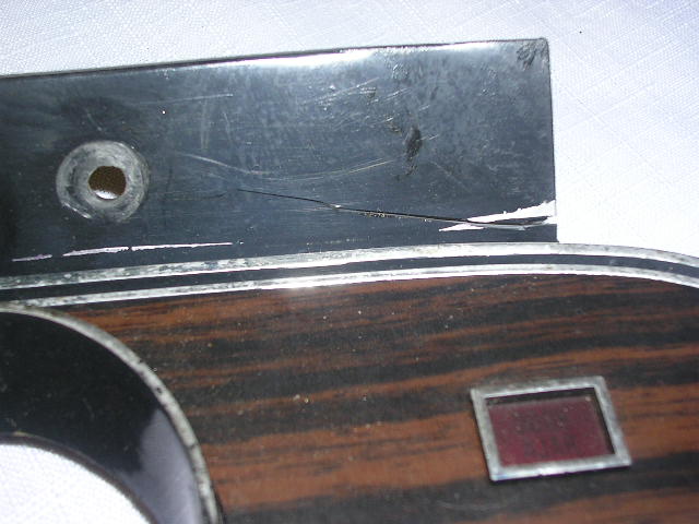 Dashboard trim with wood grain and a red indicator light