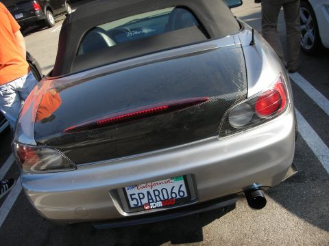 1998 Ford Crown Victoria - rear of a silver Honda S2000 roadster with a carbon-fiber trunk lid and a 5PARO66 California plate sits at a car meet.