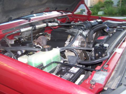 1997 Ford F-250 - Engine bay of a 1997 Ford F-250, showing the V8 engine components and radiator.