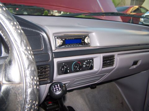 1997 Ford F-250 - Interior view of a 1992 Ford F-150 pickup truck, highlighting the dashboard and manual transmission.