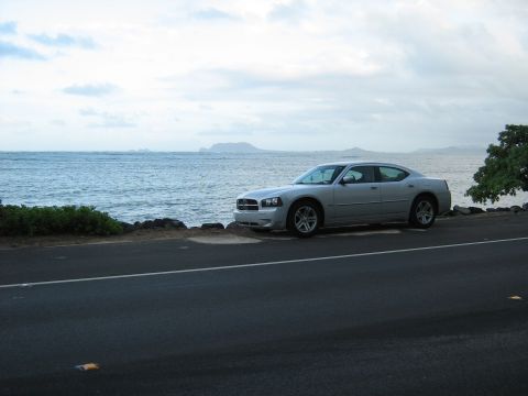 2006 Dodge Charger - Silver 2006 Dodge Charger parked by the ocean under a cloudy sky.