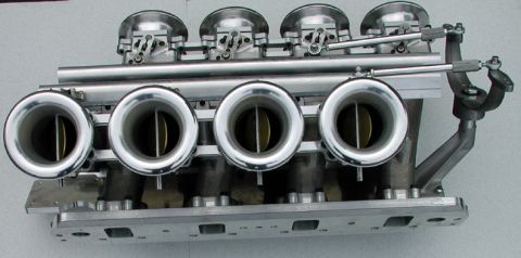 1972 Ford Ranchero - A performance cross ram intake manifold four individual throttle bodies for enhanced engine breathing.